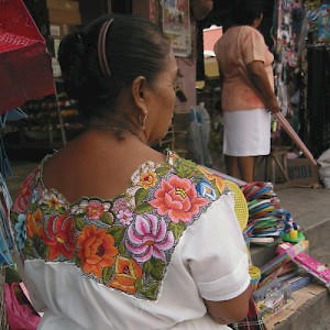 Called a huipil, the traditional dress of the Mayan women display intricate embroidery that identifies their region and history. <a href=></a>