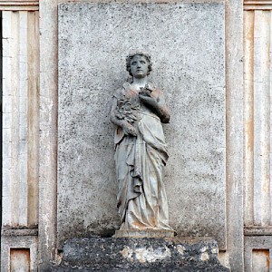 Although somewhat rare, there were hacendados who imported sculpture to enhance the hacienda's fachada or façades. This statue is one part of a group representing the four seasons and can be seen at Yaxcopoil. <a href=></a>